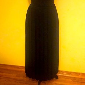 Long black skirt with pleat detail